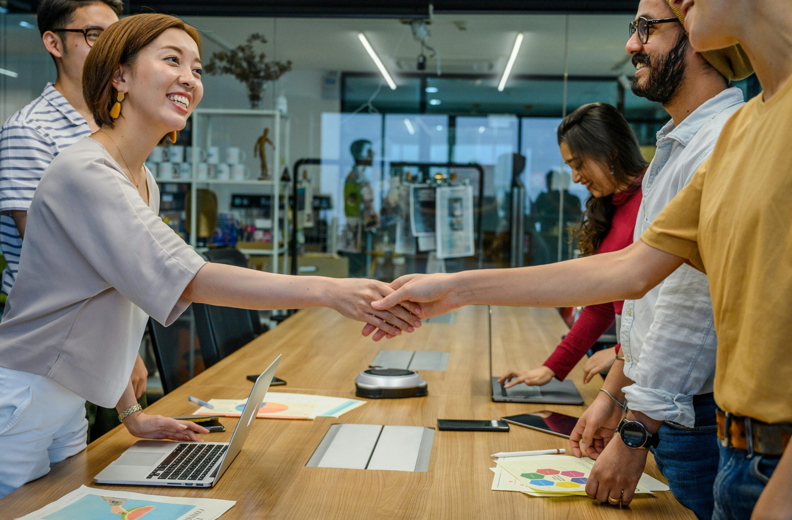 Business handshake after a software project agreement