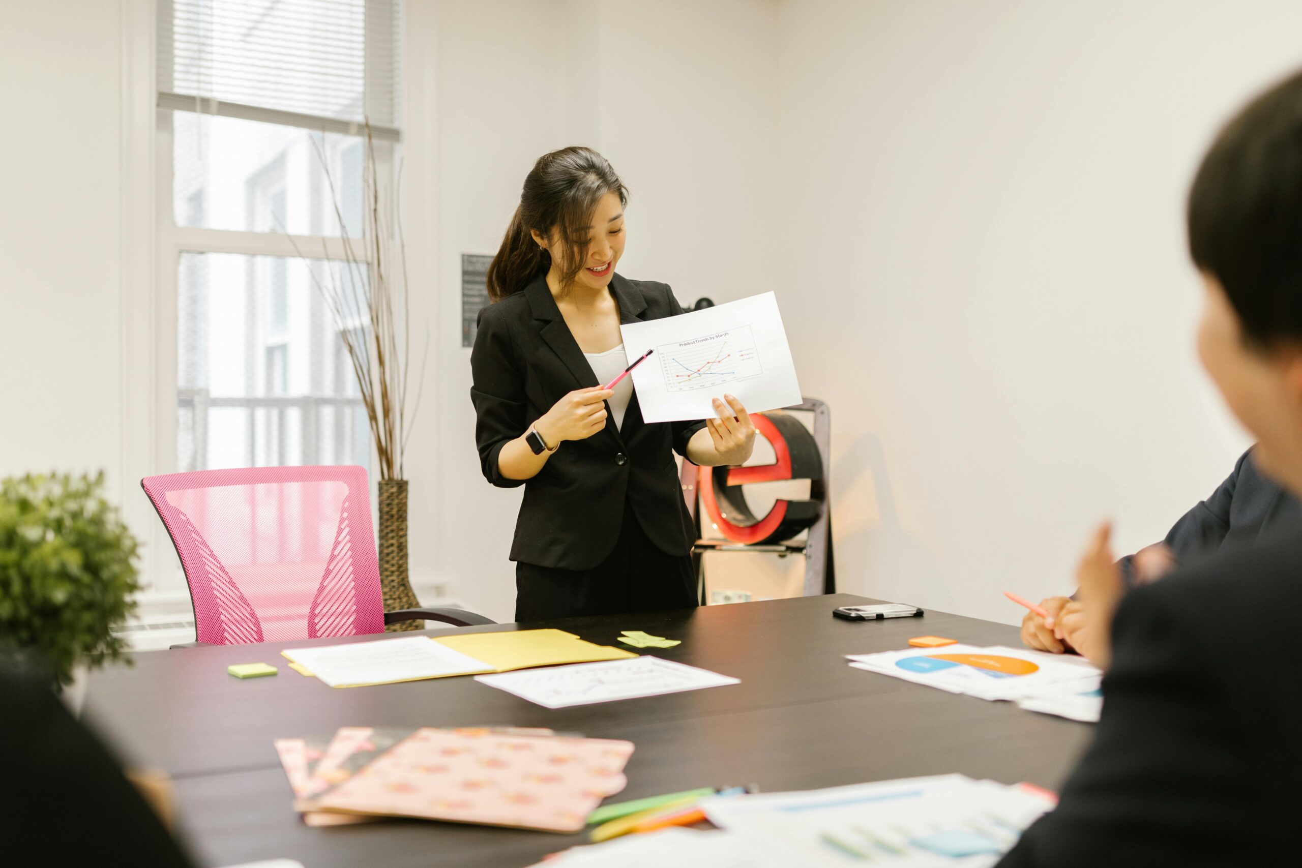 Business consultant presenting software progress to a team